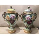 A PAIR OF ART NOUVEAU LARGE HAND PAINTED LIDDED VASES OF FLORAL DESIGN MARKS TO BASE ILLEGIBLE