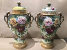 A PAIR OF ART NOUVEAU LARGE HAND PAINTED LIDDED VASES OF FLORAL DESIGN MARKS TO BASE ILLEGIBLE