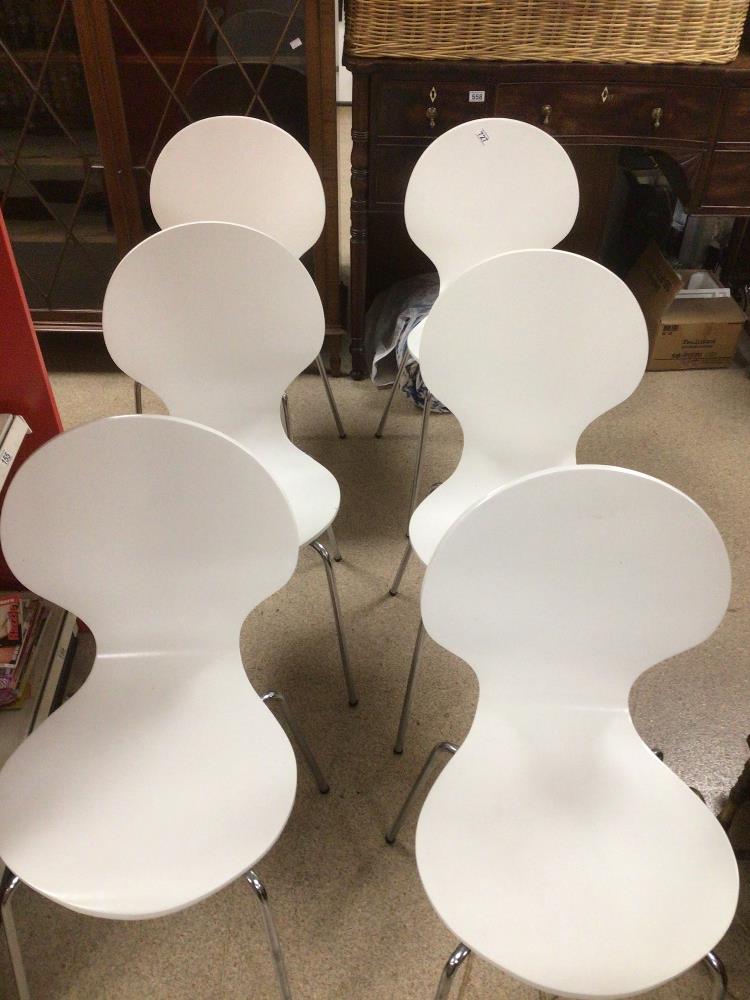A SET OF SIX STACKABLE WHITE AND CHROME LEG CHAIRS