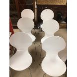 A SET OF SIX STACKABLE WHITE AND CHROME LEG CHAIRS