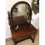 A GEORGIAN DRESSING TABLE WITH COLUMN LEGS AND BRASS WORK