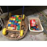 A VINTAGE PUSH A LONG TROLLOY WITH BUILDING BLOCKS AND MORE
