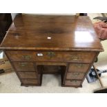 A GEORGE I WALNUT VENEERED KNEEHOLE DESK WITH FITTED INTERIOR (POSSIBLY ALTERED)