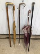 A QUANTITY OF WALKING STICKS AND CANES, UMBRELLAS, SILVER HANDLES AND TIPS