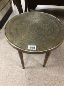 A SMALL MIDDLE EASTERN BRASS AND WOOD ROUND TABLE 38 X 39CM