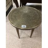 A SMALL MIDDLE EASTERN BRASS AND WOOD ROUND TABLE 38 X 39CM