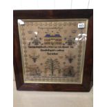 A 19TH CENTURY FRAMED AND GLAZED SAMPLER BY ANN JANE WILLIAMS AGED 12 DATED 1851 "PREPARE TO MEET