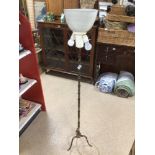 A VINTAGE BRASS STANDARD UPLIGHTER LAMP