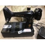 A VINTAGE ELECTRIC SINGER SEWING MACHINE NO 99