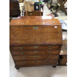 A GEORGE II LARGE WALNUT VENEERED FALL FRONT DESK WITH FITTED INTERIOR AND FOUR DRAWERS