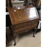 A GEORGE II FRUITWOOD FALL FRONT BUREAU WITH FITTED INTERIOR ON SHAPED CABRIOLE LEGS