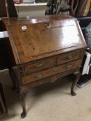 A GEORGE II FRUITWOOD FALL FRONT BUREAU WITH FITTED INTERIOR ON SHAPED CABRIOLE LEGS