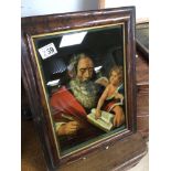 A FRAMED ANTIQUE CRISTOLEAN REVERSE PAINTING ON GLASS (ST MATTHEW) 43 X 33CM