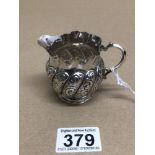 A LATE VICTORIAN HALLMARKED SILVER CREAM JUG WITH EMBOSSED WRYTHEN BODY BIRMINGHAM 1890 44 GRAMS