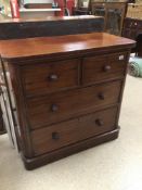 A TWO OVER TWO MAHOGANY VICTORIAN CHEST OF DRAWERS