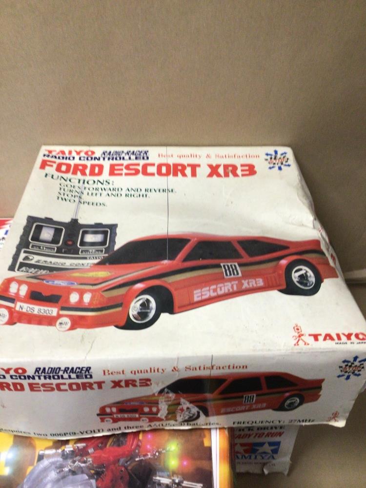 THREE BOXED REMOTE CONTROL TOYS, THUNDER SHOT BY TAMIYA, FORD ESCORT XR3 BY TAIYO, AND R.A.T.S BY - Image 3 of 8