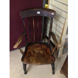 A VINTAGE WINDSOR ARMCHAIR MARKED J.C 72 ON BACK