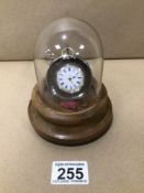 A WOODEN, POCKET WATCH STAND WITH DOMED GLASS AND LADIES CONTINENTAL SILVER FOB WATCH £15 P/P