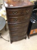 A BOW FRONTED GLOVE CHEST WITH SEVEN DRAWERS 107 X 48 X 39CM