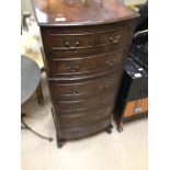 A BOW FRONTED GLOVE CHEST WITH SEVEN DRAWERS 107 X 48 X 39CM