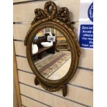 A SMALL MODERN GILDED MIRROR DECORATED IN SWAG TAILS 45 X 31CM