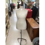 A VINTAGE SHOP MANNEQUIN ON METAL ADJUSTABLE FRAME