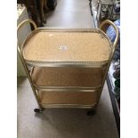 A VINTAGE GILDED METAL FRAMED THREE TIER TEA TROLLEY