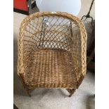 A VINTAGE WICKER CHAIR