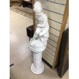 A LADY FIGURINE SAT UPON A CHALK BASE PEDESTAL TOTAL HEIGHT 124CM