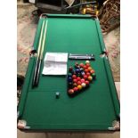 A FOLDAWAY 4.6 FOOT POOL/SNOOKER TABLE BY DEBUT SPORT