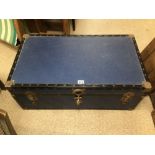 A VINTAGE BLUE BRASS BOUND TRUNK