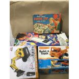 FOUR VINTAGE BOXES OF GAMES AND TOYS UNCHECKED, INCLUDING A MATCHBOX "BUILD A TRUCK", A COMMODORE