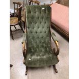 A VINTAGE GREEN VELVET BUTTON BACK LOUNGER ROCKING CHAIR