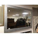 A MODERN BEVELLED EDGED MIRROR IN FRAME 105 X 74CM