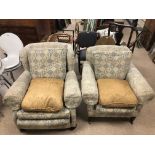 A PAIR OF VINTAGE ARMCHAIRS ON ORIGINAL CASTORS