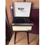 A BUSH CLASSIC RETRO RECORD PLAYER ON SPLAYED LEGS