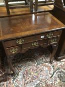A VINTAGE FOUR DRAWER CHEST ON CABRIOLE LEGS