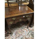 A VINTAGE FOUR DRAWER CHEST ON CABRIOLE LEGS