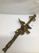 A GILDED WOODEN CARVED WALL HANGING IN THE FORM OF AN EAGLE WITH A CANDLE BRANCH A/F
