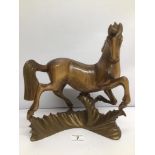 A RUSSIAN WOOD SCULPTURE TITLED TRANSLATED 'DANCING HORSE' SIGNED UNDERNEATH APPROX 32CM HIGH
