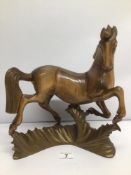 A RUSSIAN WOOD SCULPTURE TITLED TRANSLATED 'DANCING HORSE' SIGNED UNDERNEATH APPROX 32CM HIGH