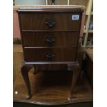 A MAHOGANY THREE DRAWER BEDSIDE CHEST