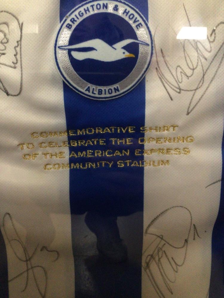 A FRAMED AND GLAZED BRIGHTON AND HOVE ALBION SIGNED FOOTBALL SHIRT FROM THE FIRST GAME AT THE AMEX - Image 2 of 3