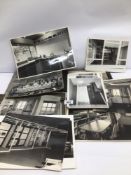 AN ALBUM OF ANTIQUE BLACK AND WHITE PHOTOGRAPHS MANY OF WHICH ARE LOOSE TOGETHER WITH NEWSPAPER