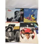 A SMALL VINTAGE COLLECTION OF VINYL RECORDS INCLUDING ROLLING STONES, BEATLES, T-REX, AND MORE