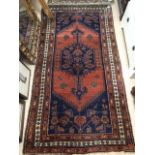 A VINTAGE WOOL RUG 198 X 103CM