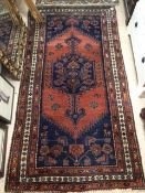 A VINTAGE WOOL RUG 198 X 103CM