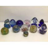 A COLLECTION OF UNMARKED GLASS PAPERWEIGHTS