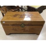 A CAMPHOR CHEST WITH CARVED ORIENTAL SCENES