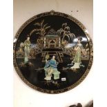 A ROUND BLACK LACQUERED CHINOSIERE HAND-PAINTED PANEL 76 DIAMETER